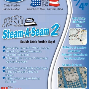 May include: A package of Steam-A-Seam 2 double stick fusible tape. The package is blue and white with a red, white, and blue American flag. The tape is 1/4 inch wide and 40 yards long. The package also includes instructions for using the tape in English, Spanish, French, and German.