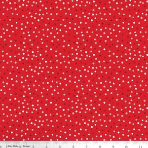 May include: Red fabric with a repeating pattern of small, irregularly spaced white, silver, and light red dots. The dots vary in size and are scattered across the surface. The fabric is likely cotton or a similar material.