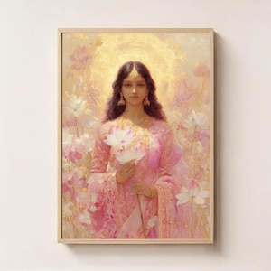 May include: A framed artwork featuring a woman in a pink sari holding white lotus flowers. The painting has a golden halo and is surrounded by pink and white flowers. The woman has dark hair and is wearing gold jewelry.