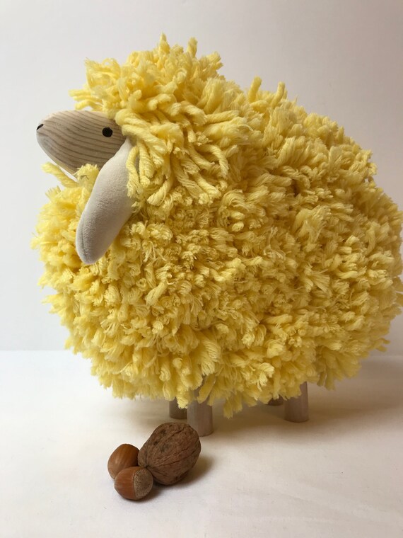 wooden sheep with wool