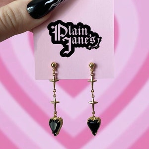 Black heart gold cross earrings
