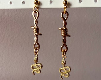 Gold tone barbed wire snake earrings