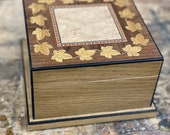 Handmade oak box with laser cut marquetry ivy leaf design.