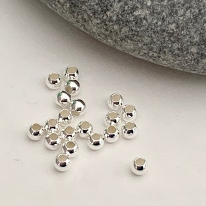Per batch of 10 smooth beads 2.5 mm hole 1.2mm solid silver 925/1000