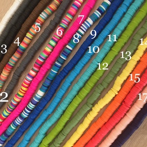 May include: A close-up of 18 different strands of colorful round beads. The beads are arranged in a row from left to right, with each strand numbered from 1 to 18.