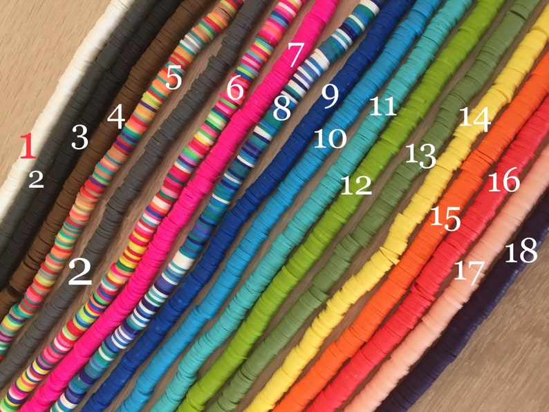 May include: A close-up of 18 different strands of colorful round beads. The beads are arranged in a row from left to right, with each strand numbered from 1 to 18.