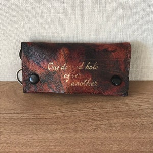 Vintage Brown Marbled Leather Needle Case with Scissors, Needles, Darning Thread with 'One Darned Hole After Another' Embossed on the Cover
