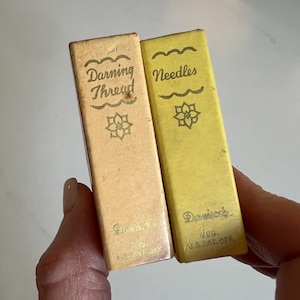 May include: A set of three ceramic mugs with a speckled, matte finish. The mugs are in shades of cream, light gray, and dark gray. Each mug has a simple, minimalist design, perfect for coffee or tea.