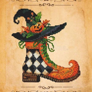 May include: A cross-stitch design of a witch's boot and hat, perfect for Halloween. The black hat is adorned with a carved pumpkin and fall leaves. The boot features a black and white diamond pattern, with an orange and green curved toe.