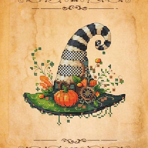 May include: A cross-stitch design of a witch's hat with a black and white striped top and a green brim. The hat is decorated with a pumpkin, flowers, and a small wheel. The background is a textured, aged paper.