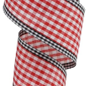May include: A wide fabric ribbon featuring a classic red and white gingham check pattern. The edges of the ribbon are finished with a distinct black and white checkered border, providing a sharp contrast to the red and white center design.