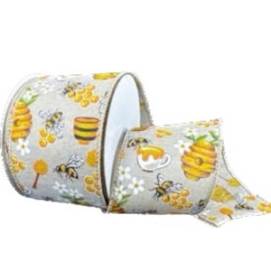 May include: A roll of decorative ribbon with a bee-themed design. The ribbon features illustrations of honeycombs, bees, honey pots, and flowers in yellow, brown, and white on a light gray background. The ribbon is suitable for crafts and gift wrapping.