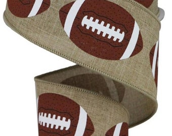 May include: A roll of brown burlap ribbon with white and brown footballs printed on it. The ribbon is 2.5 inches wide.