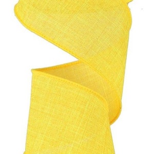 May include: A roll of bright yellow burlap ribbon. The ribbon has a textured, woven look and is perfect for crafting and decorating.