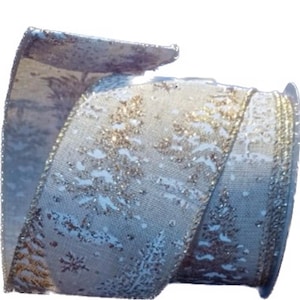 May include: A roll of decorative ribbon featuring a winter forest design. The ribbon has a light blue background with gold and silver accents, including images of pine trees and snowflakes. The edges are trimmed with gold.