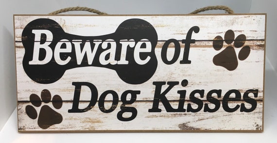 beware of dog kisses sign