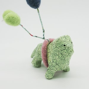 Green paper mache lion with needle felt balloons image 1