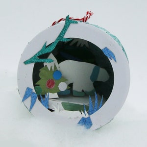 Paper mache Christmas ball and paper cut polar bear