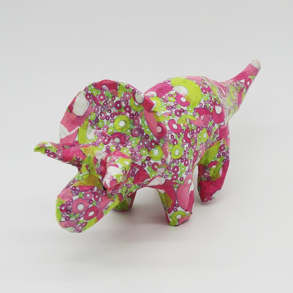 Pink and green paper mache dinosaur triceratops