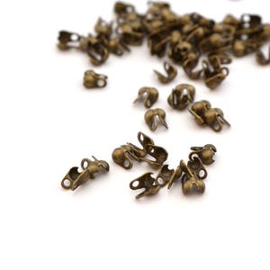 100 mini antique bronze knot cover tips for ball chain 1 to 1.5mm image 1