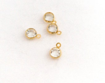 2 mini pendentifs ronds inox doré et strass blanc 9 mm