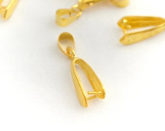 May include: A set of gold-toned metal pendant clasps. The clasps are designed to hold a pendant or charm.