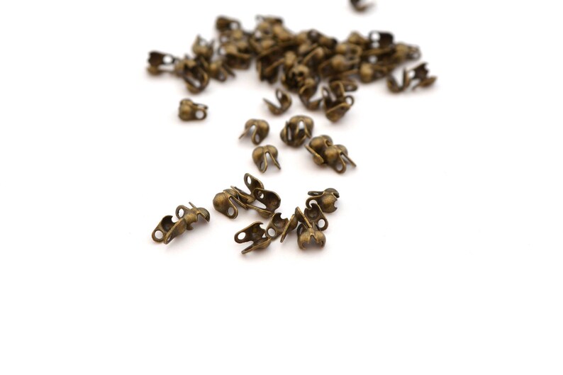 100 mini antique bronze knot cover tips for ball chain 1 to 1.5mm image 1