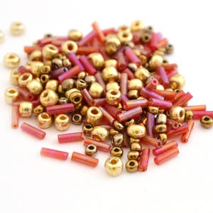 10Gr Golden bronze and orange-pink glass seed beads