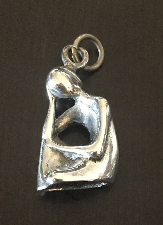 Sterling Silver Pendant of Woman Resting her Head,