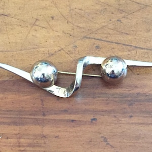 Gold Monet Nadel oder Brosche