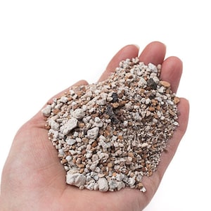 May include: A handful of small, light brown and white rocks. The rocks are a mix of sizes and shapes.