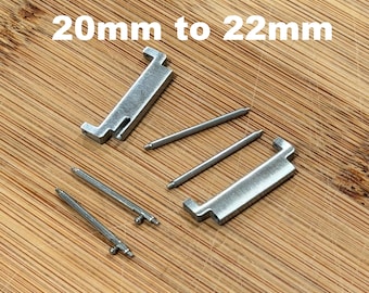 Adattatore per cinturino per orologio da 20 mm a 22 mm, colore argento, finitura opaca spazzolata, set da 2 pezzi.