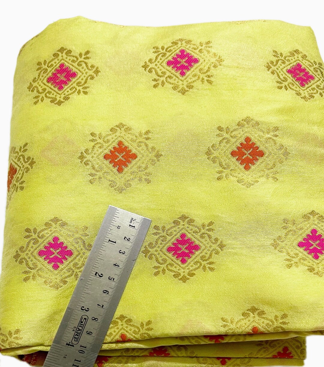 Lemon yellow woven brocade fabric used as visual metaphor for phishing lures that captivate employees