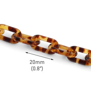 May include: A close-up of a brown and yellow plastic chain with a tortoiseshell pattern. The chain is 20mm (0.8 inches) wide.