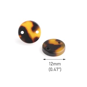 Op de afbeelding: Twee bruine en gele schildpadknopen met elk twee gaten. De knopen hebben een diameter van 12 mm (0,47").