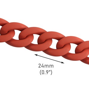 May include: Close-up of a red chain link with a measurement of 24mm (0.9").