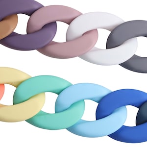 以下が含まれることがあります： カラフルで厚みのある楕円形のリンクでできたチェーン。チェーンはシリコン製で、ブラウン、パープル、ピンク、ホワイト、グレー、オレンジ、イエロー、ターコイズ、ライトブルー、ブルーなど、さまざまな色があります。