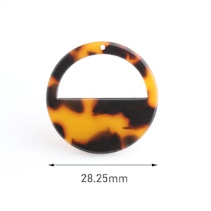 May include: A round, tortoiseshell-patterned acrylic pendant with a semi-circle cutout. The pendant has a small hole at the top for stringing. The diameter is 28.25mm.