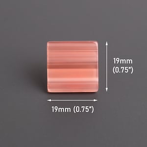 May include: A square, translucent, pink and white striped object, measuring 0.75 inches on each side. The object is set against a gray background. The dimensions are clearly labeled.