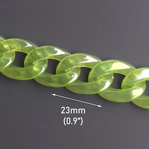 May include: A close-up of a lime green plastic chain with a link size of 23mm (0.9 inches).