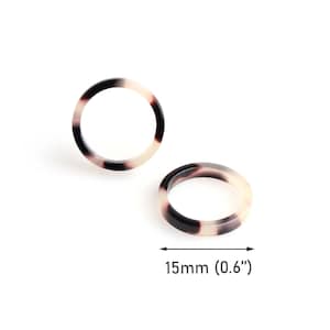 May include: Two tortoiseshell-patterned plastic rings, each with a diameter of 0.6 inches (15 mm).