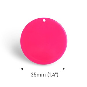 May include: A bright pink, round, plastic disc with a hole in the center. The disc measures 1.4 inches in diameter.