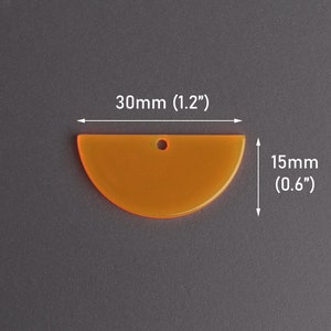 May include: An orange, semi-circular acrylic pendant with a small hole for hanging. The pendant measures 30mm (1.2 inches) wide and 15mm (0.6 inches) high. The background is a solid gray.