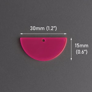 May include: A bright pink acrylic half circle with a hole in the top. The half circle measures 1.2 inches wide and 0.6 inches tall.