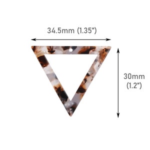 May include: A white, brown, and black triangle-shaped acrylic pendant with a hole at the top. The pendant measures 1.35 inches wide and 1.2 inches tall.