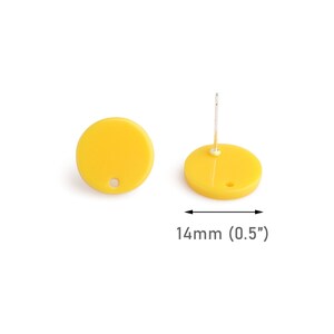 May include: A pair of yellow round stud earrings, each measuring 0.5 inches in diameter. The earrings have a small hole in the center for the post.