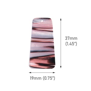 May include: A rectangular pendant with a hole at the top, featuring a swirling pattern of pink, white, and black. The pendant is 1.45 inches long and 0.75 inches wide, with a slightly tapered shape.