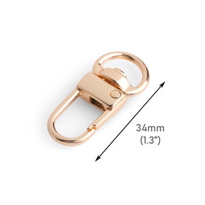 May include: Gold-toned metal swivel clasp with a 1.3 inch (34 mm) length. The clasp has a D-ring on one end and a hook on the other.
