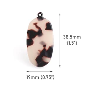 May include: A white and brown oval-shaped pendant with a hole at the top. The pendant is 1.5 inches tall and 0.75 inches wide.