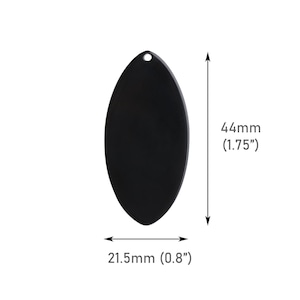 May include: Black oval-shaped metal pendant with a hole at the top. The pendant measures 4.4 cm in height and 2.1 cm in width.